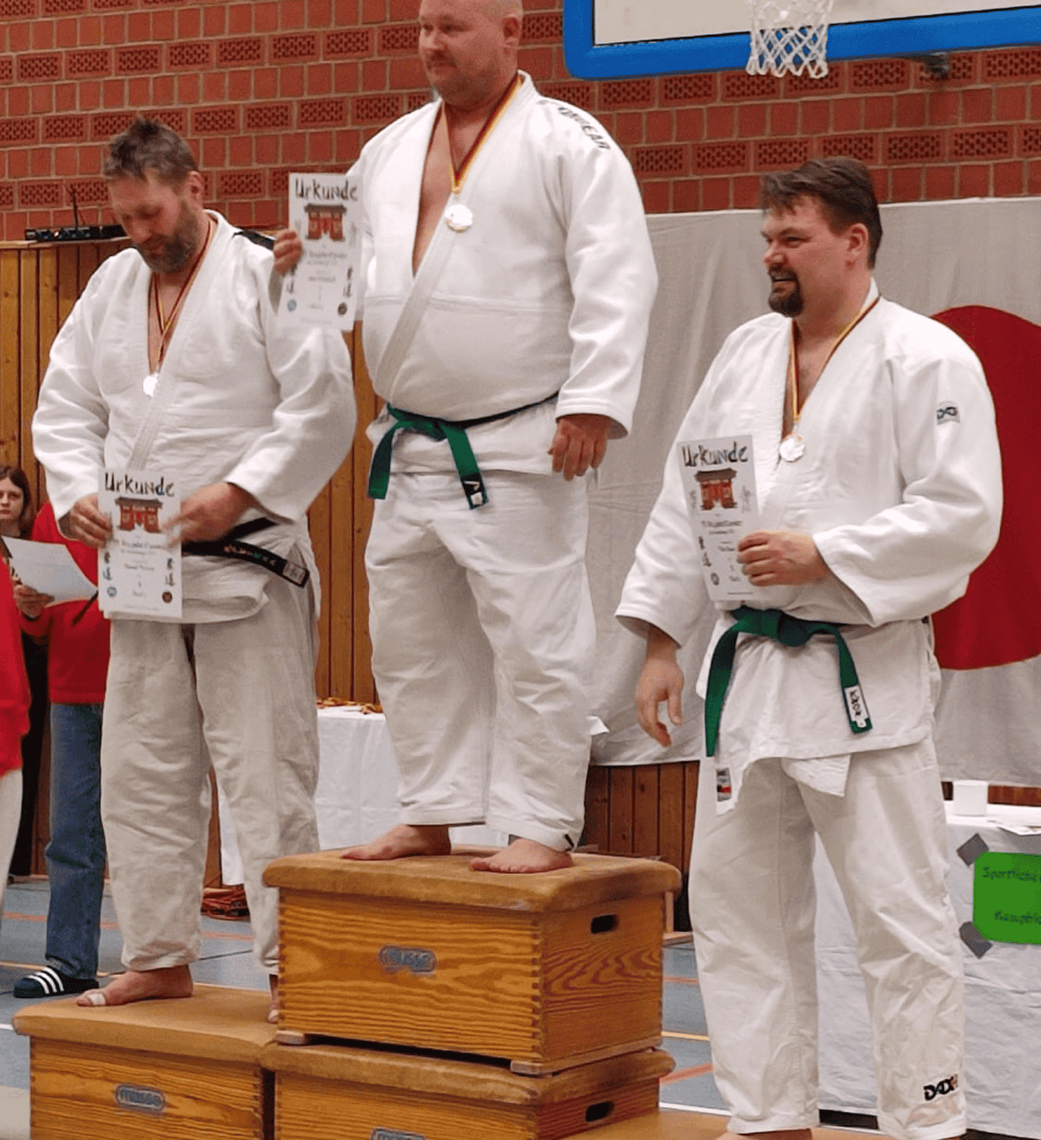 Drei Judoka auf dem Siegerpodest
